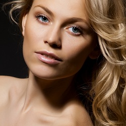 A woman showcasing Sculptra
