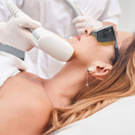 happy woman getting laser skin treatment on her chin